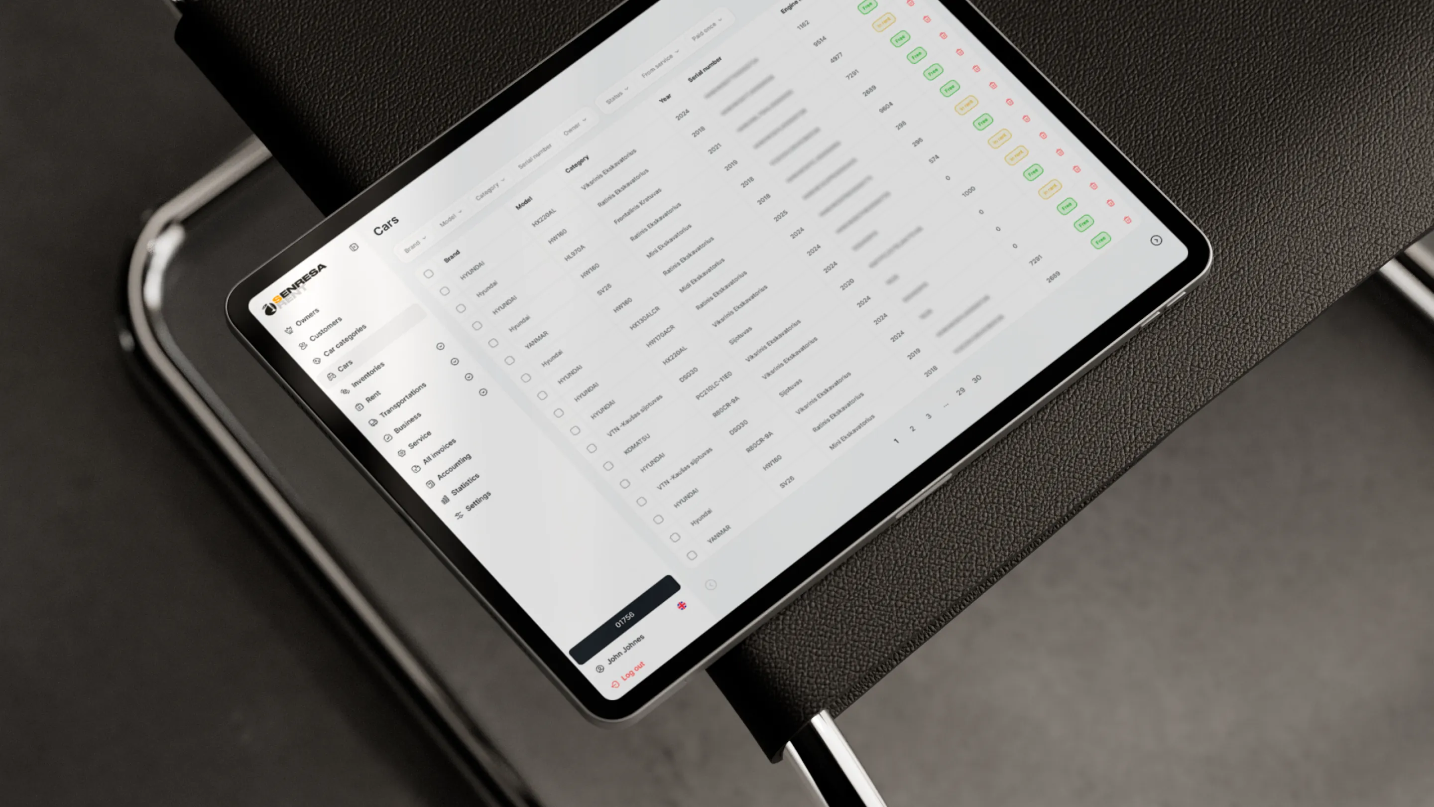 Senresa CRM cars list on a tablet lying on a dark leather seat